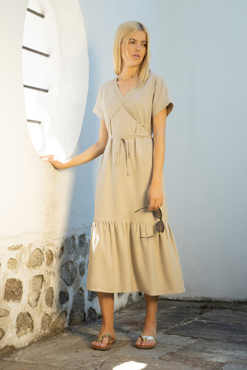 Linen midi dress with a low tiered hem and a tie-around belt